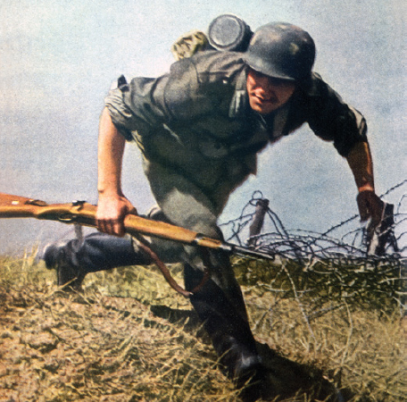 A wartime German propaganda photo of a soldier with a Kar 98k Millions of - photo 4