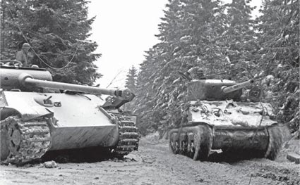 An M4A3 76mm of Co C 774th Tank Battalion passes by a knocked-out Panther - photo 1