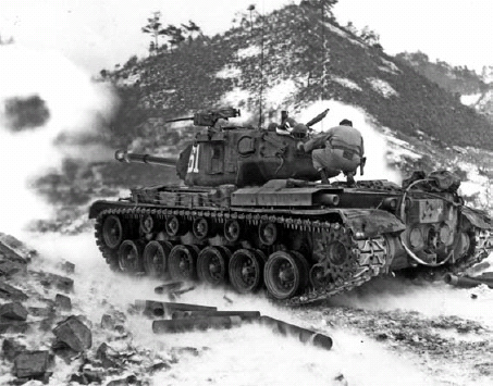 Snow billows as an M46 of Co C US Army 6th Tank Battalion fires its 90mm gun - photo 3