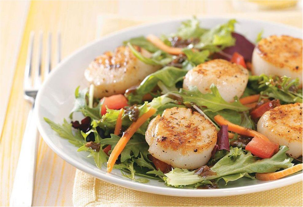 Leafy greens topped with seared scallops and served with chopped tomatoes - photo 6