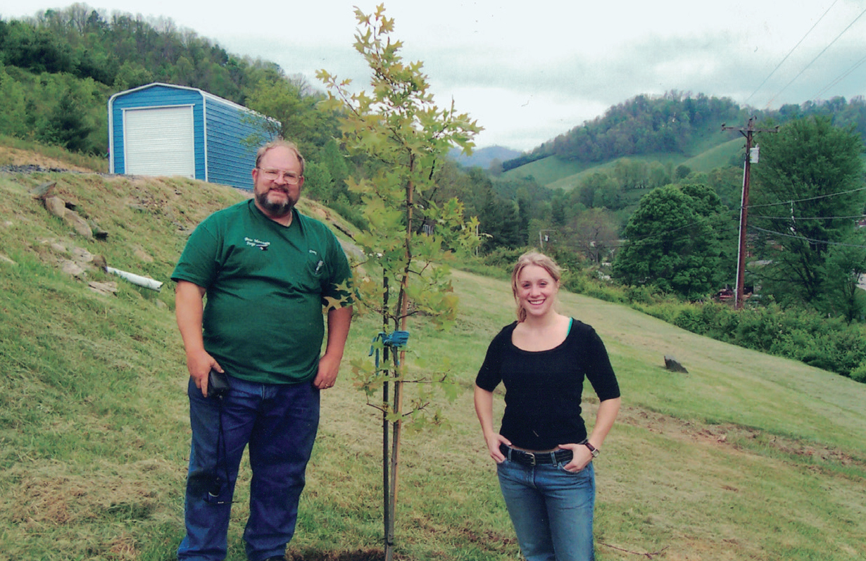 Uncle Doug and me with a tree we planted on his land in North Carolina The - photo 4