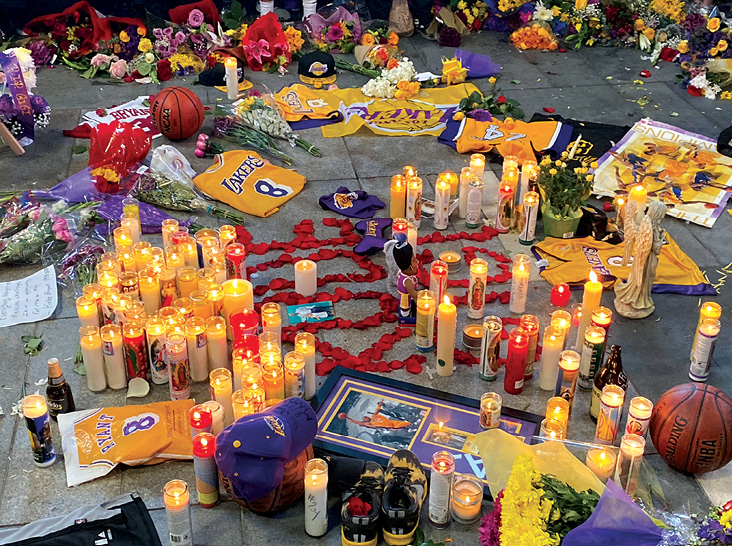 Fans mourn the loss of Kobe Bryant in front of LA Live across from Staples - photo 6