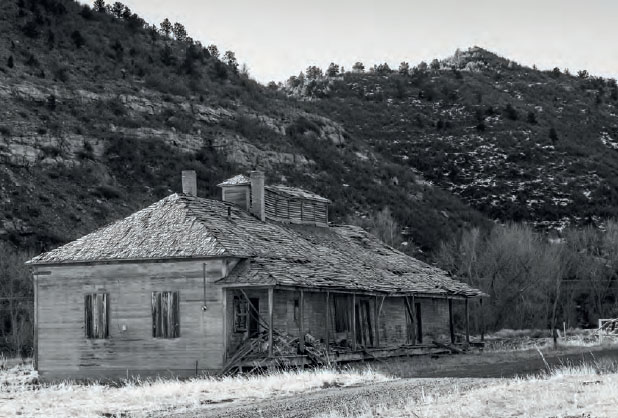 The collapsing remains of the mining companys main office no longer a driving - photo 4