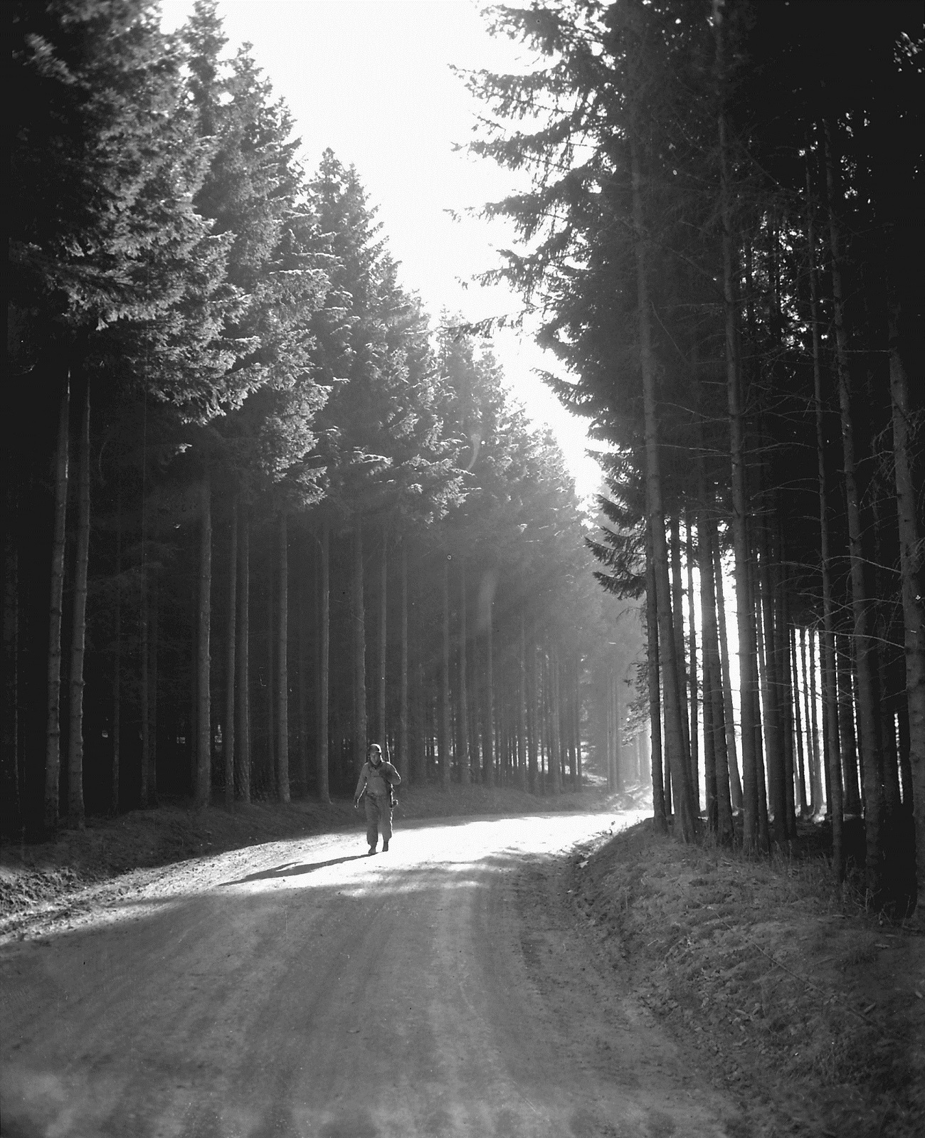 An American soldier walks along a deserted road in the Luxembourg area of the - photo 1