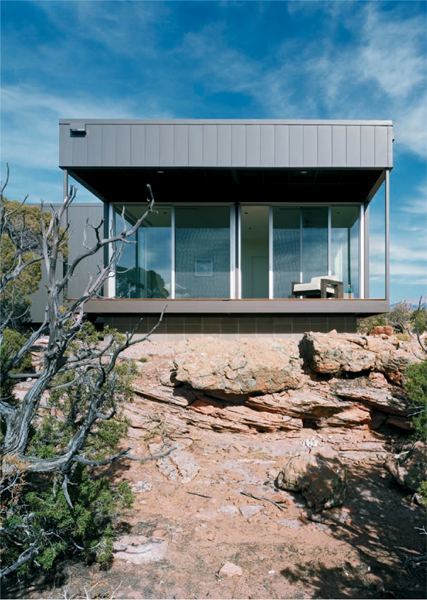 The main axis of this vacation home runs along a rocky hillside providing - photo 7