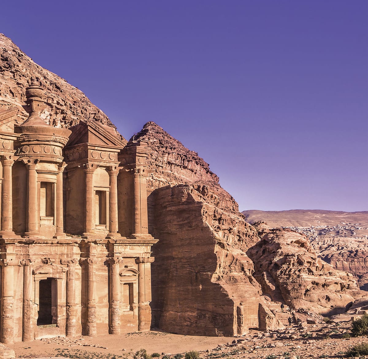 Trek through the desert to Jordans famed rose-red city of Petra shown Then - photo 6