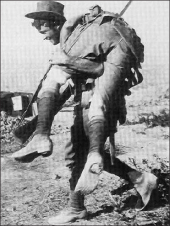 An Australian Digger carries a wounded comrade back to a dressing station in - photo 2