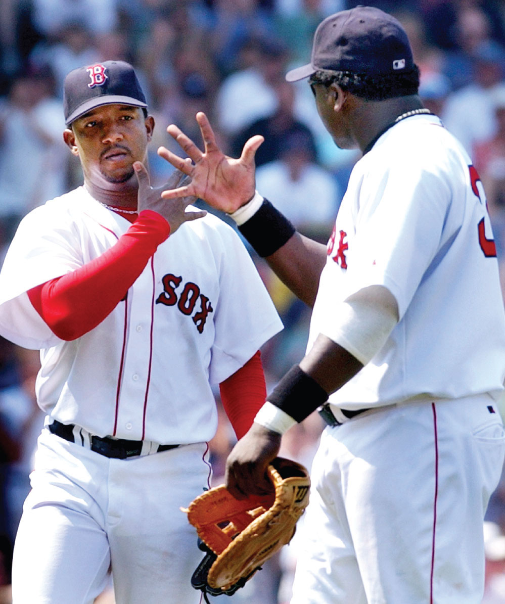 Ortiz gives Pedro Martinez a hand as Martinez leaves a game in June 2003 and - photo 7