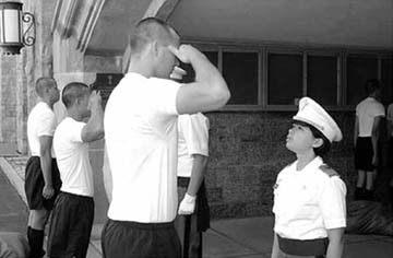 A new cadet on left entering West Point salutes the cadet in the Red Sash on - photo 2