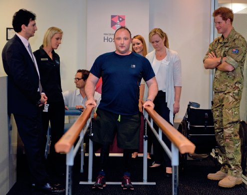 Prince Harry looks on as Lieutenant Alistair Spearing the fourth British - photo 2