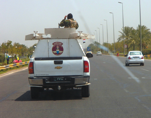 One of the armed escort vehicles in the convoy carrying me and my team along - photo 4