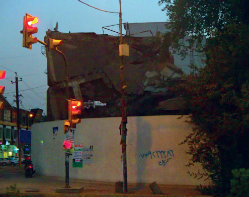 Just beyond the functioning faade of Baghdad a damaged building remains - photo 14