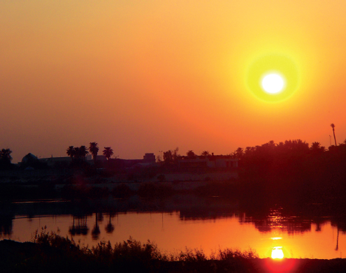 Sunset over the Tigris River Solitary Iraqi soldiers armed with machine - photo 19