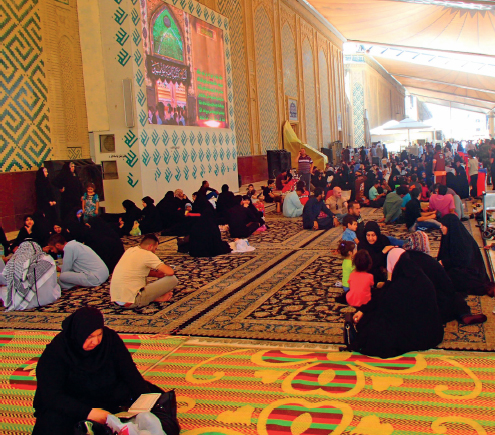 Worshippers gather on carpets outside the Imam Ali Mosque before joining Friday - photo 25