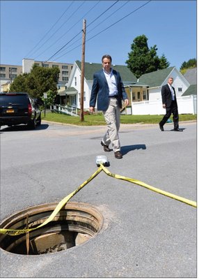 Governor Cuomo views the manhole from which the inmates escaped Photo by - photo 15