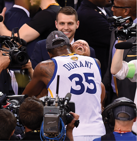 Warriors superstars Steph Curry and Kevin Durant embrace after fulfilling their - photo 5