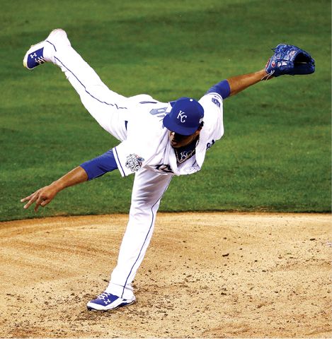 Just hours after his father had passed away Edinson Volquez pitches during - photo 9