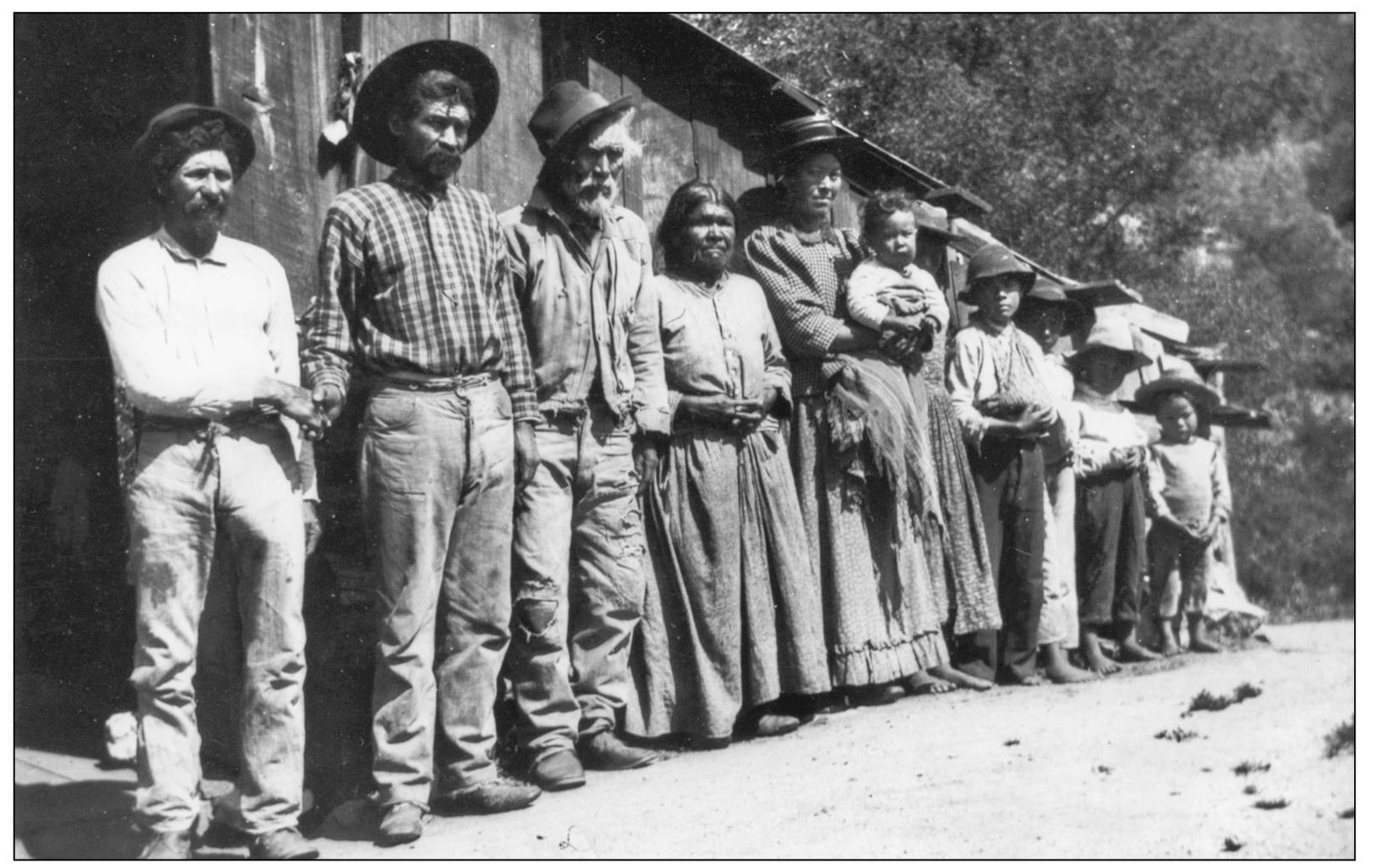 Mutsun Indians pictured in 1906 stand in front of a building constructed - photo 6