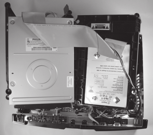 Figure 3-1 Position the disk drives so that the front edge of the motherboard - photo 2