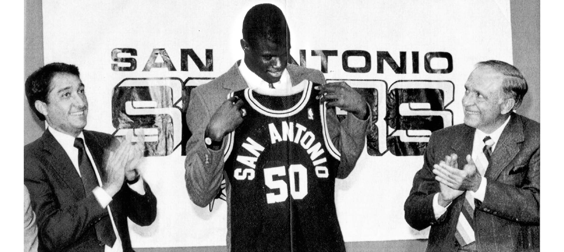 David Robinson holds up his new jersey as he is welcomed to San Antonio by - photo 8