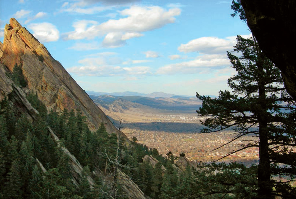 The city of Boulder spreads out beneath a striking rock formation on the Royal - photo 7