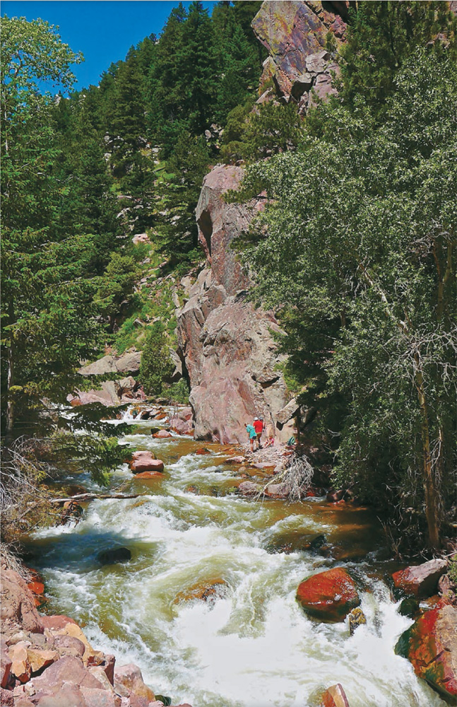 Hikers take a break next to the stream in Eldorado Canyon Lake Agnes sits - photo 23