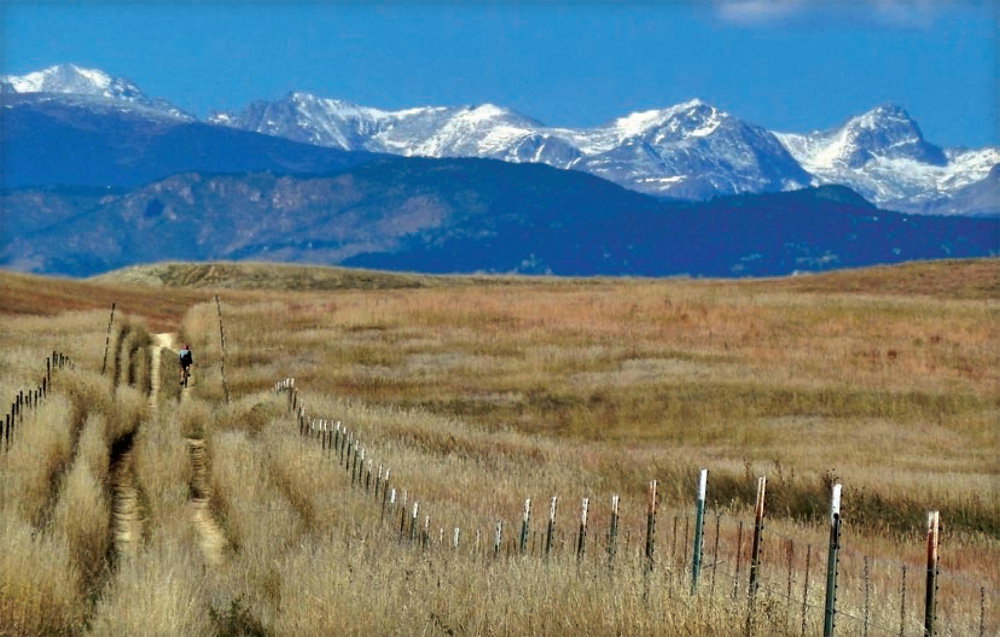 A biker enjoys the rolling plains of Gunbarrel Farm Snow-dotted peaks of - photo 28