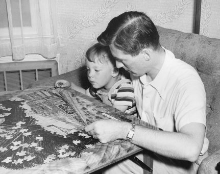 Richard Fogg with a little help from his father assembles a 1948 puzzle which - photo 4