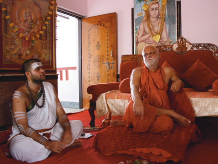 The Shankaracharya of Puri right sitting on his throne next to his chief - photo 11