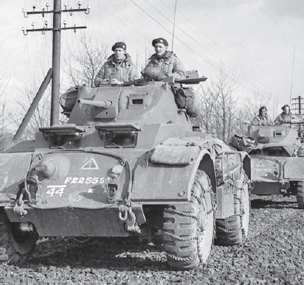 A column of Staghounds from A Squadron XII Manitoba Dragoons moves along a - photo 2