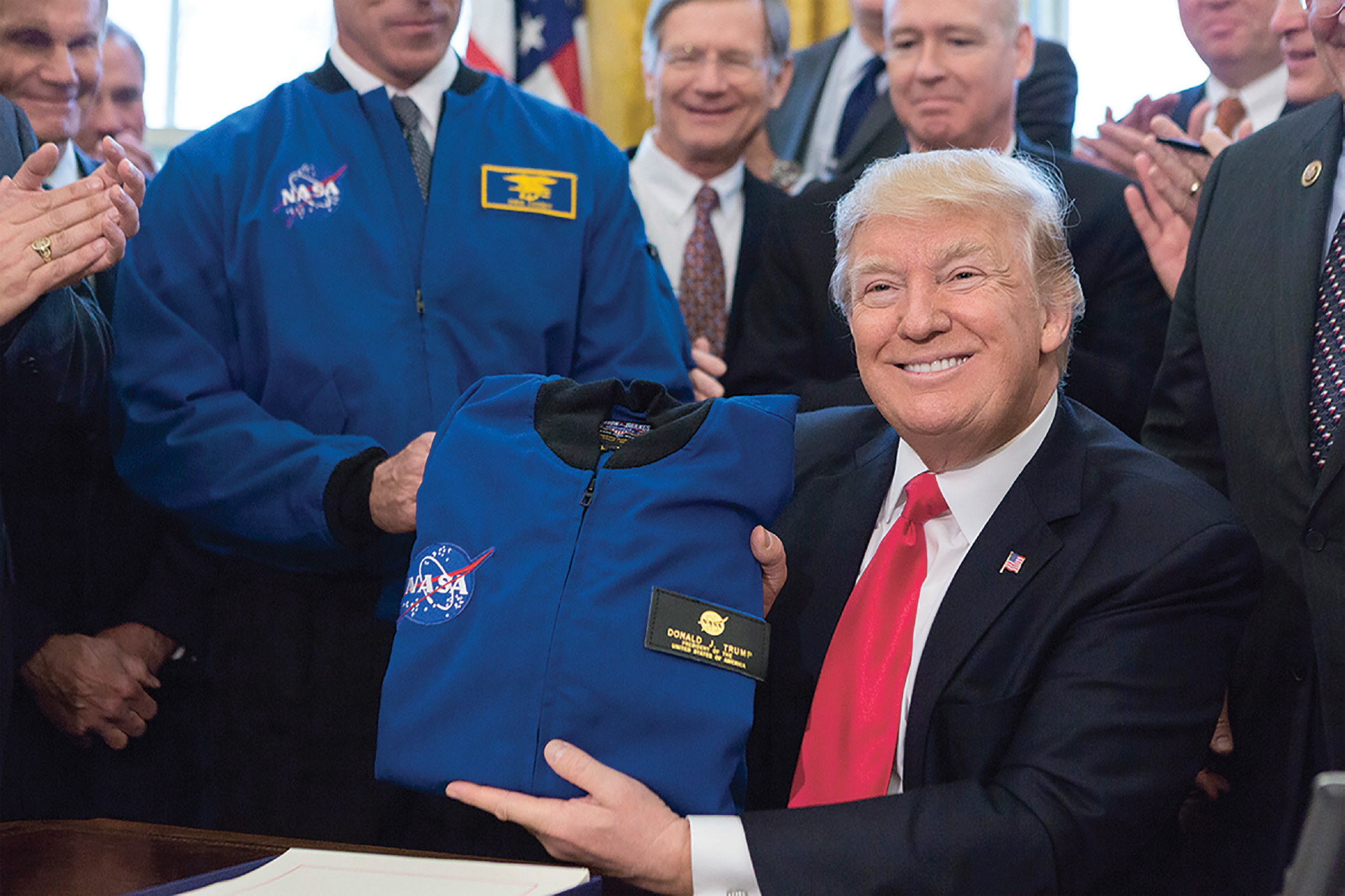 March 21 2017 Holding up a NASA jacket after signing S422 the National - photo 24