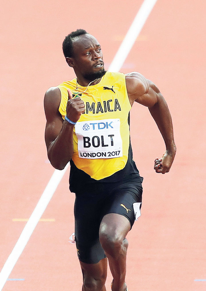 Usain Bolt strains every sinew during the 100m heats at the World Athletics - photo 23