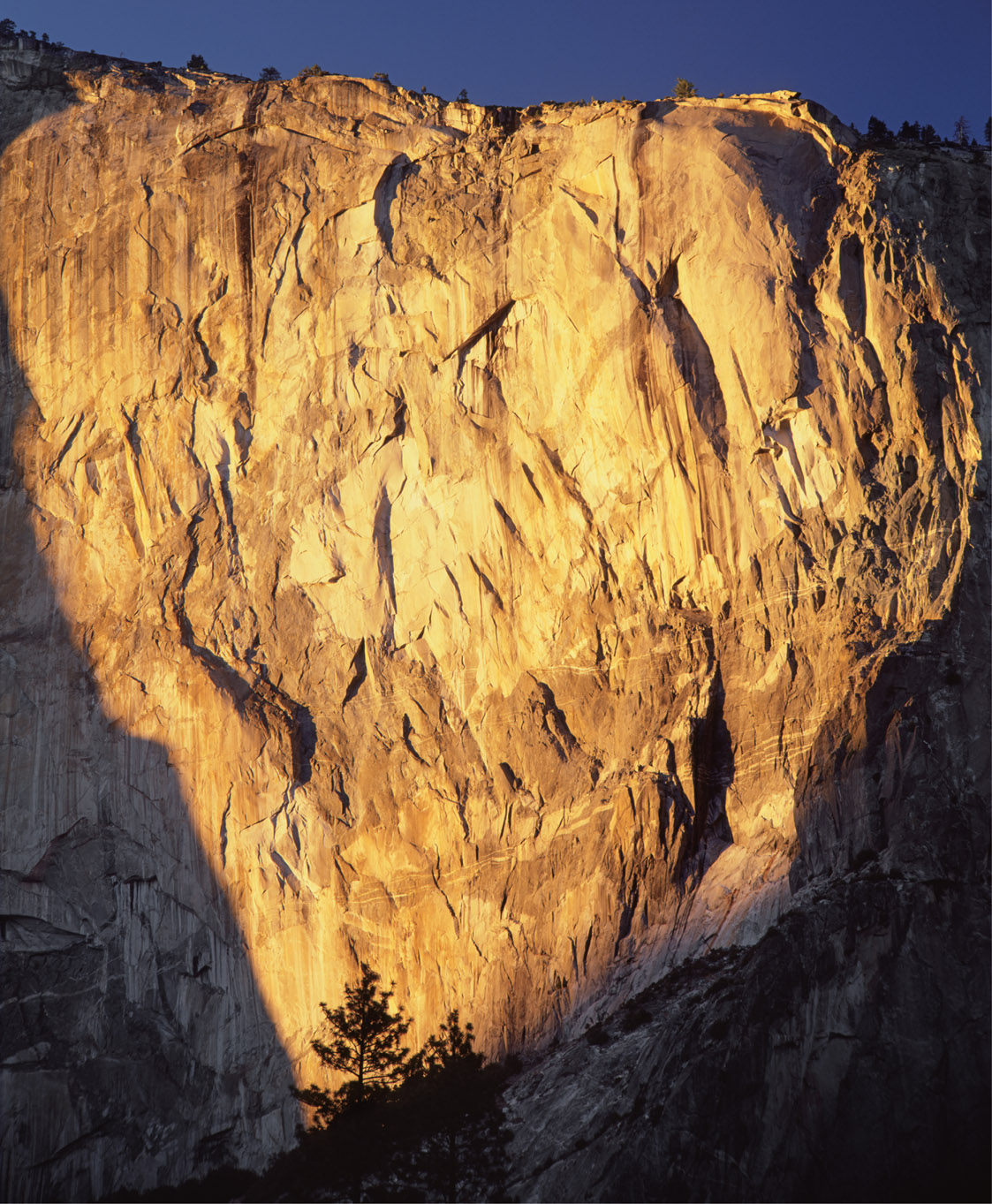 A setting sun illuminates the eastern portion of the southeast face of El - photo 12