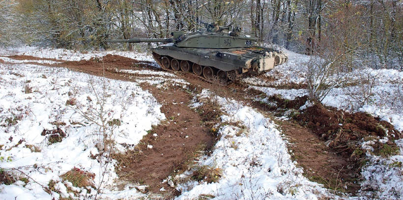 A Challenger 2 of the SCOTS DG deployed in training on snowy ground prior to - photo 4