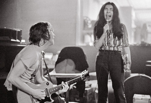 John Lennon and Yoko Ono during the recording of Sometime in New York City at - photo 16