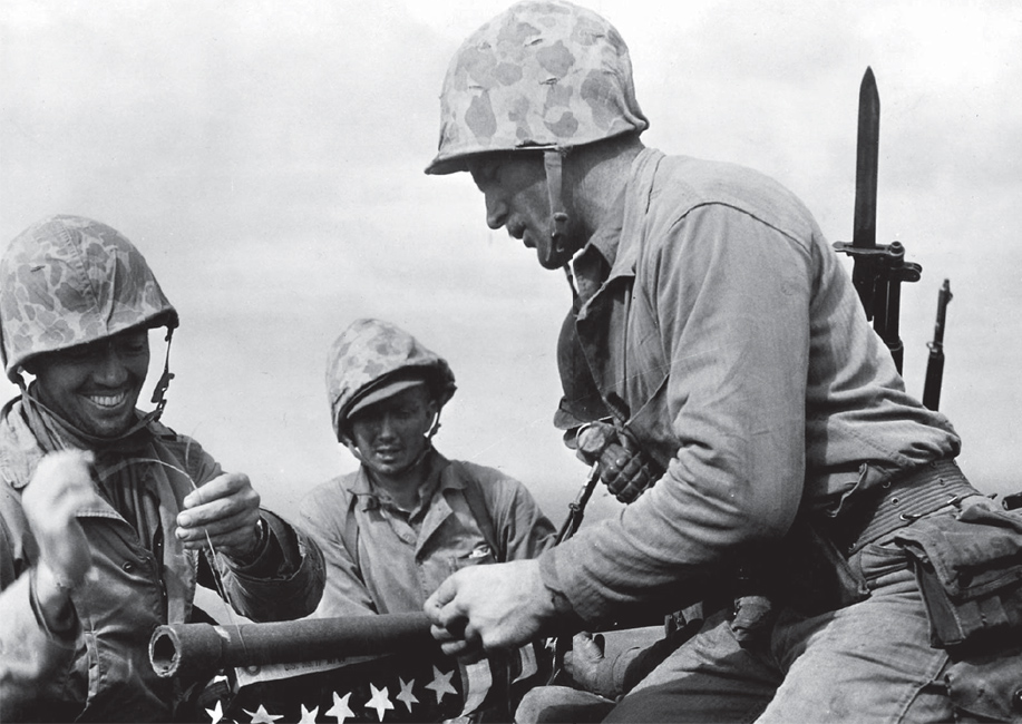 Marines on Mount Suribachi Iwo Jima wiring the US flag onto a pole for the - photo 5