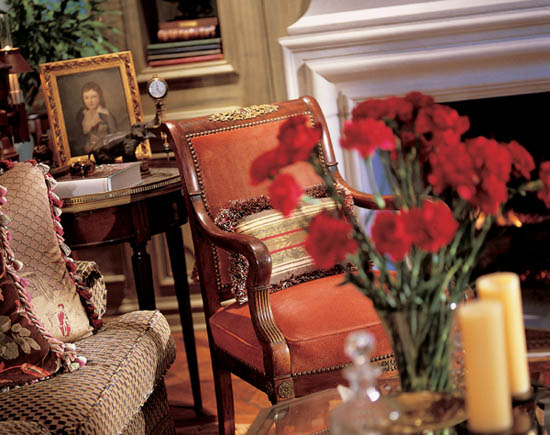 In a library an Empire mahogany armchair features bronze trim and flanks a - photo 2