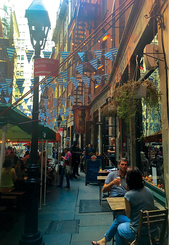 One of Manhattans oldest streets Stone Street see is lined with cafes and - photo 11