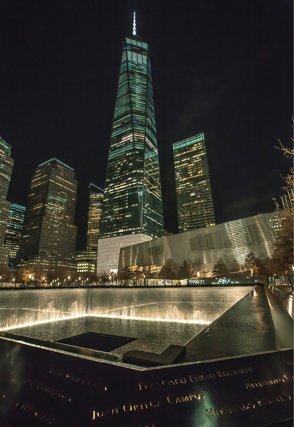 Names cut into the rim of the 911 Memorial fountains remember those who - photo 10
