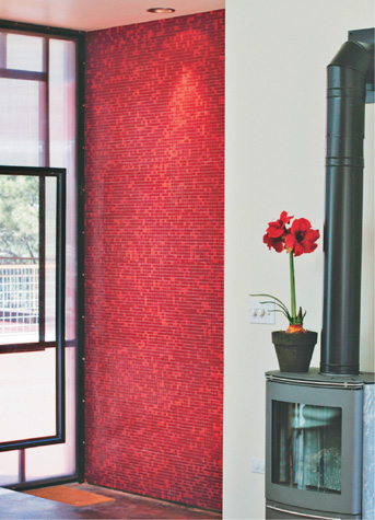 Small mosaic tile in two colors provides a dramatic backdrop for a contemporary - photo 10