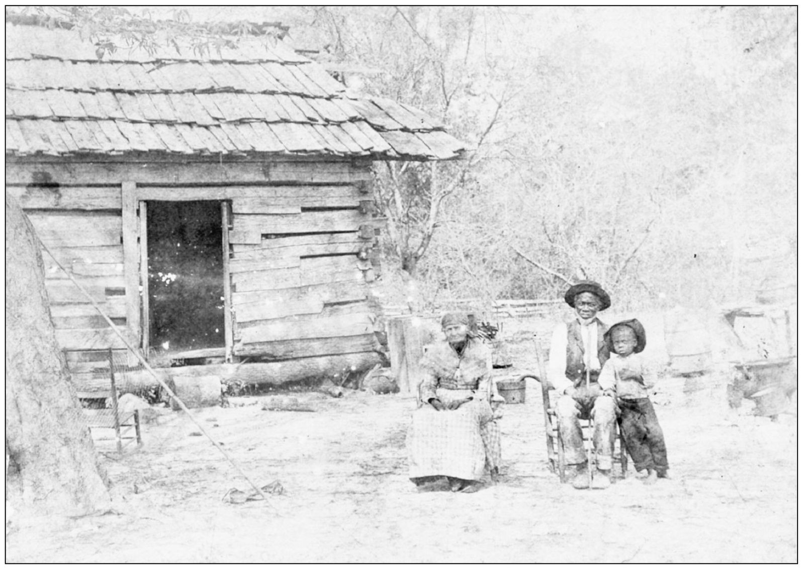 PIONEER LOG CABIN An unknown elderly couple with their grandchild portrays a - photo 3