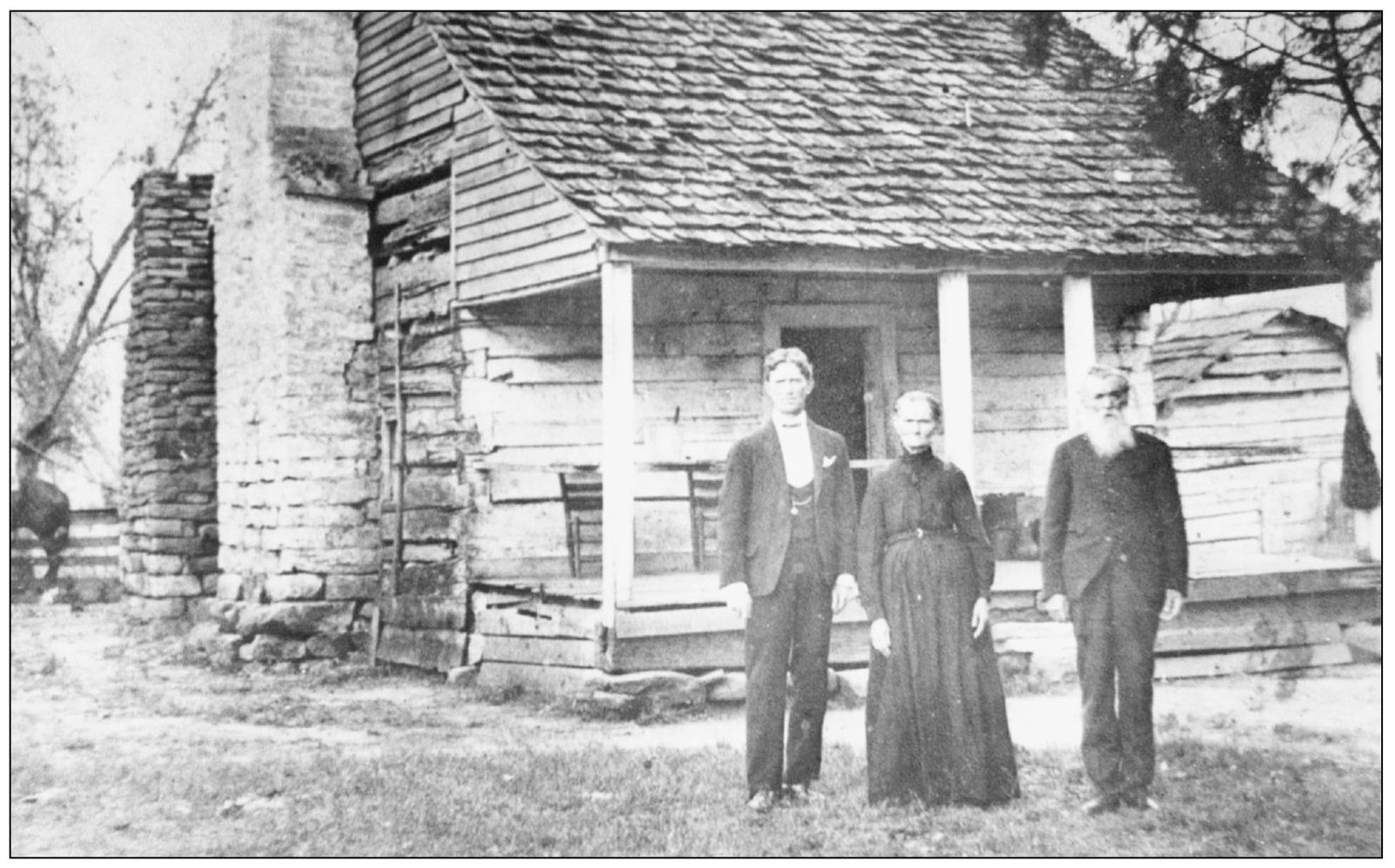 SHINGLES LOGS AND STONE An unidentified familypa ma and sonare posed in - photo 5