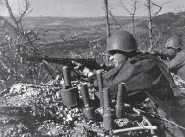 During World War II Soviet submachine-gunners take up position in a gulley In - photo 5