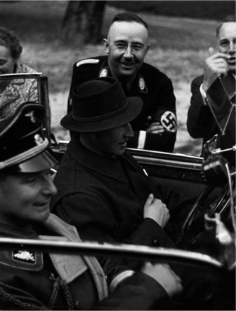 Heinrich Himmler looks on as Heydrich and Himmlers personal adjutant Karl - photo 13