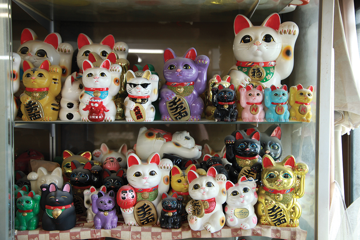 An array of maneki neko figurines at the Baigetsu Tomimoto Doll Factory Inc - photo 11