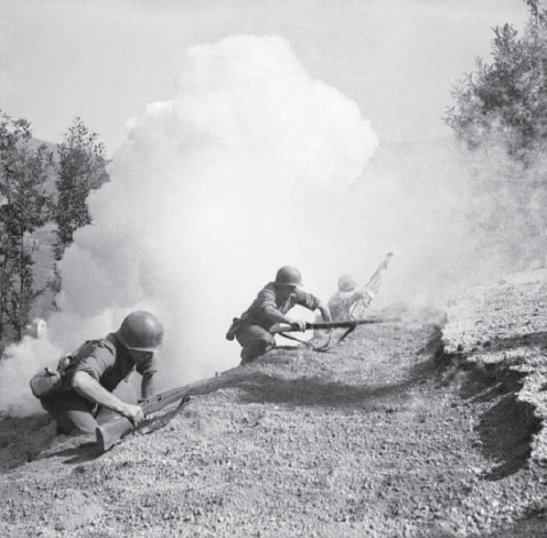 US Rangers advance under smoke in the mountains outside of Naples in October of - photo 3