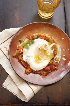 Traditionally served for breakfast in Mexico huevos rancheros piles crisp corn - photo 9