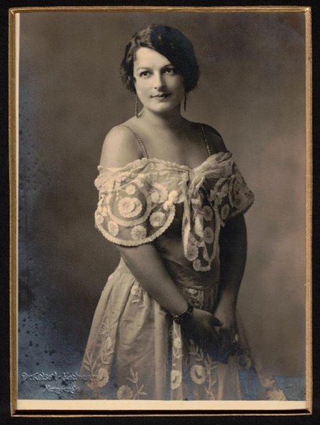 Nell Tritton in a dress of white French lace photographed before a dance at her - photo 1