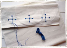 Along each of the two short edges embroider three dark-blue crosses Start - photo 14