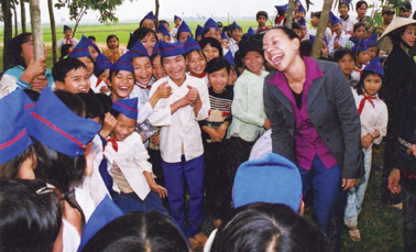 Sharing a moment with schoolchildren during a visit to Cambodia with the Select - photo 27